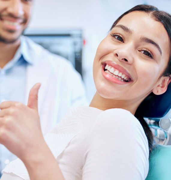 Smiling woman outside with healthy teeth
